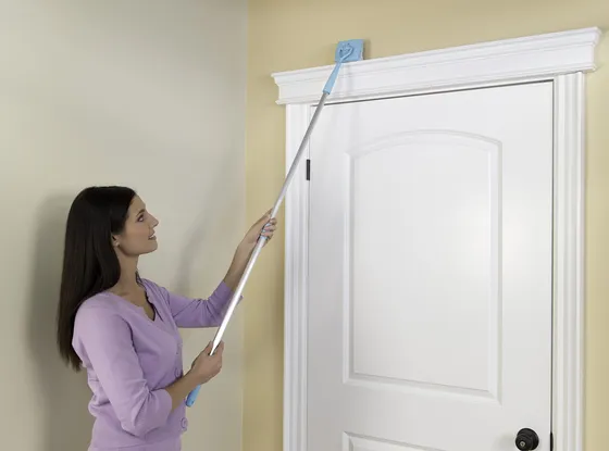 Reaching the top of a door casing from the floor